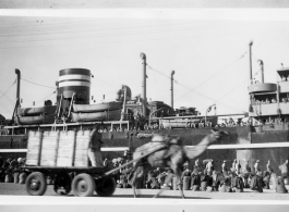 Views of the bustle at the docks at Karachi around the troopship MS Torrens that would take the Americans, including Schuhart, home, in late 1945.