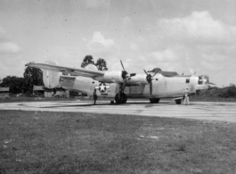 A B-24 bomber on pavement at an airbase in in Burma during WWII.