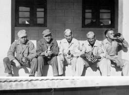 2005th Ordnance men drink beer and relax, likely in India, during WWII.