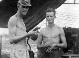 Men of 2005th Ordnance Maintenance Company, 28th Air Depot Group, prepare to spray paint anti-aircraft gun in Burma during WWII.