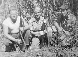 Men of 330th Troop Carrier, 9th CC, out hunting, stand in a field with carbines in the CBI during WWII.  Left to right: R. C. Werner, Milt Sobel, and K.J. Tolley.  From the collection of Arnold Wall. (Much appreciation to son D. W.)