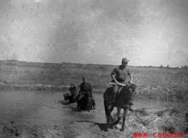 GIs on horses in northern China, carbines held at the ready. Edward Gable served in northern China.