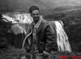 Jose Martinez, airplane mechanic with the 396th, standing in front of the Huangguoshu waterfall in Guizhou (Kweichow) province, China.   Image courtesy of Elmer Bukey.