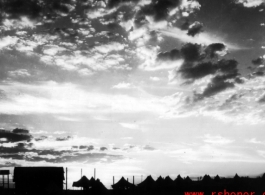 Tents for GIs at the American base at Liuzhou during WWII, silhouetted against the sunset.