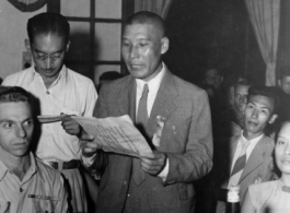 A Chinese VIP reads a speech at a banquet in China during WWII.