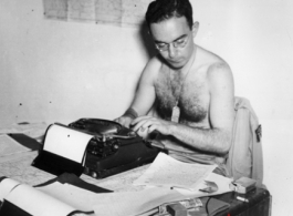 Teddy White at the typewriter during WWII.  From the collection of Hal Geer.