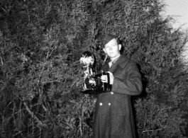 A picture of 16th Combat Camera Unit cameraman Hal Geer with a camera.