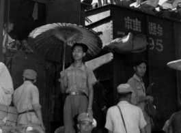 Chinese wait at the train station in Liuzhou during WWII, in the fall of 1944, as the Japanese advanced during the Ichigo campaign.