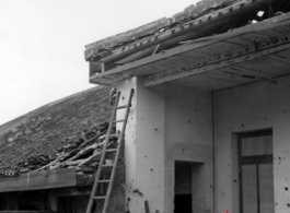 Bomb damage to a building at an American base in China during WWII.