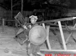 People transporting possessions in Guangxi province during WWII, possibly in preparation to fleeing in the face of the Japanese Ichigo campaign.