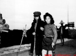 Chinese refugees walking during summer/fall 1944, fleeing the Japanese advance during Ichigo. In Guangxi province, China, during WWII.