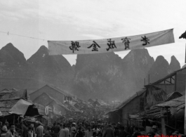 A crowded street in Liuzhou city, Guangxi province, probably just before the evacuation for Ichigo in the fall of 1944. The banner advertises a brand of product.