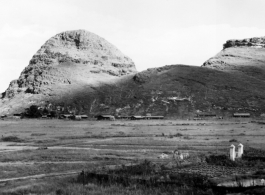 Air base buildings at the base of a karst mountain at the US base at Guilin, in Guangxi province, China, during WWII.