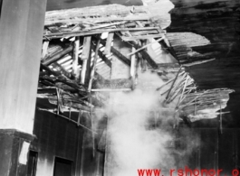 Bomb damage to a building at an American base in China during WWII.