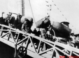 GIs line up to disembark ship on the way back to the US after the war. The ship is probably the SS Marine Raven.