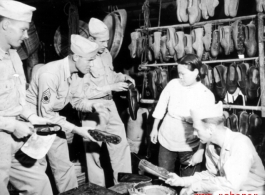 GIs buying shoes in China during WWII.