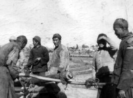 Rural men carry a wooden coffin in SW China during WWII.