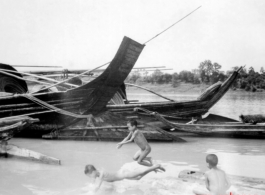 Kids swimming in a river in southern China during WWII.