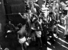 GIs line up for mess on ship on the way back to the US after the war. The ship is probably the SS Marine Raven.