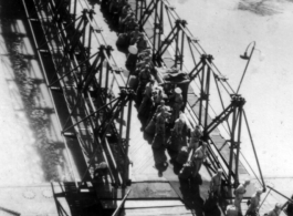 GIs line up to board ship on the way back to the US after the war. The ship is probably the SS Marine Raven.