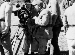 Chinese troops look at movie camera.