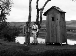 A man talks to a lonely Chinese sentry somewhere in Yunnan province, China.