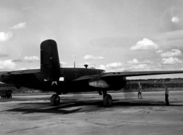 A B-25 in the CBI is directed to taxi by ground personnel.