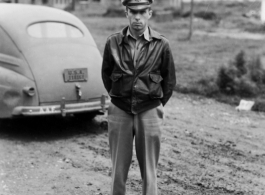 An American serviceman in the CBI with a sedan car.  From the collection of Wozniak, combat photographer for the 491st Bomb Squadron, in the CBI.