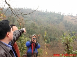 Mr. YA pointing to the hillside where the plane crashed.  Villagers say the plane came in at night, in the dark, then circled dropping flares, before finally crashing.  A large number of Chinese soldiers were on the plane, supposedly just returned from training abroad, and all died, along with the two Americans. At least one additional American bailed out of the airplane, was injured, but ultimately survived, and was taken from the valley a couple days after the crash.