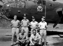 Officers of the 22nd Bombardment Squadron stand before one of the squadron's B-25D's at Chakulia Air Base, India.