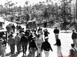 American GIs at Yangkai base in Yunnan province in the CBI walk on the road. During WWII.