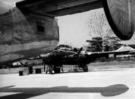 A B-25 as seen from under the wing of an Air Transport Command (ATC) C-109 transport plane based on the B-24 air frame.  From the collection of David Firman, 61st Air Service Group.