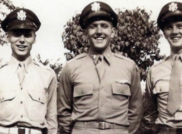 Walter G. Daniels and two of his fellow officers pose in uniform with smiles all around. During WWII.