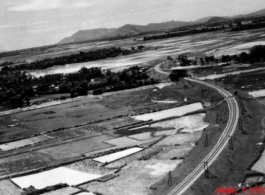 An aerial photograph taken from an American war plane over a Japanese-held railway in SW China or Indo-China during WWII in the CBI.