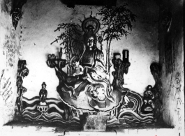 Figure inside a Buddhist temple in China. During WWII.