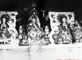 Figures inside a Buddhist temple in China. During WWII.