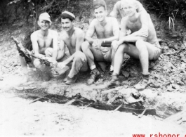 "Time out now and then"  The boys roasting meat over a fire pit.  Rex G. Gouger is on the far right.