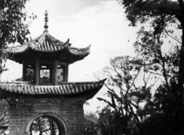 Architecture in Yunnan province, China: A decorative arch as a passageway in a village in rural Yunnan, during WWII.