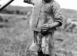 Local farm boy in Yunnan, China, during WWII.