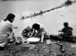 Local women in Yunnan province, China wash clothes by hand during WWII.