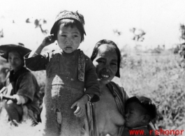 A mother and children in Yunnan province, China, during WWII.