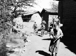 Local people in China: Villagers move around village.  From the collection of Eugene T. Wozniak.