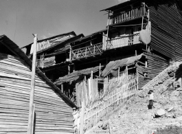 Wooden houses on hillside, either near Kunming in Yunnan province, or in Guilin or Liuzhou in Guangxi province, during WWII.