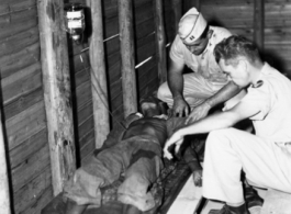 A Chinese soldier receives medical treatment from American medical personnel in the CBI during WWII.