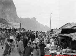 A bustling street at Liuzhou to the south of the river, near the American air base in WWII.  From the collection of Hal Geer.