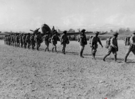 10 AF 10DEC44 G165-10 Chinese Troops march to plane in Burma during WWII. 