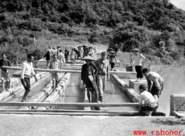 Bridge demolition during the evacuation before the Japanese Ichigo advance in 1944, in Guangxi province.