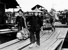 People crossing the floating bridge at Liuzhou during WWII.