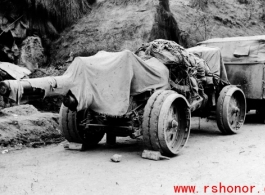 Chinese heavy gun by the side of the road in southwest China, during WWII.  Notice the rigid wheels--rubber was in short supply during wartime.