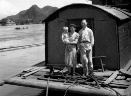 A western family on a barge in a river in Guangxi province, probably near Liuzhou city or Guilin city.  Selig Seidler was a member of the 16th Combat Camera Unit in the CBI during WWII.